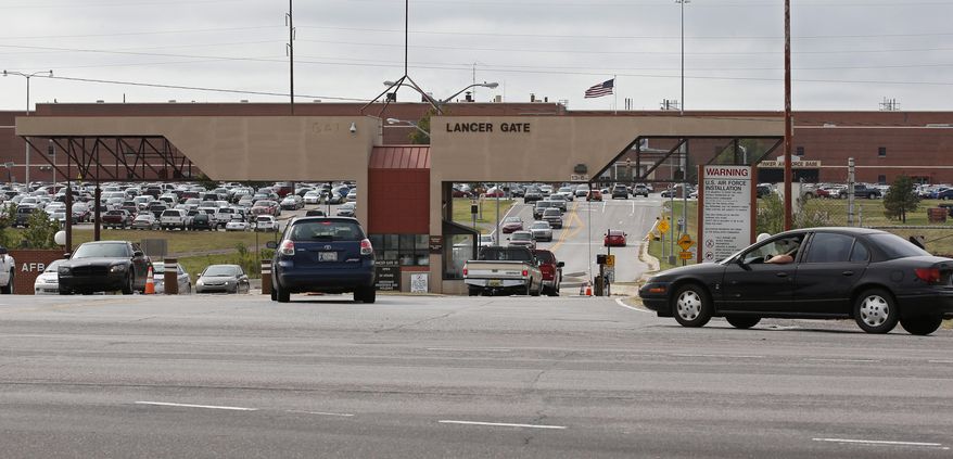 Vehicles drive in and out of Lancer Gate at Tinker Air Force Base in Oklahoma City, Wednesday, Oct. 12, 2016. (AP Photo/Sue Ogrocki) ** FILE **