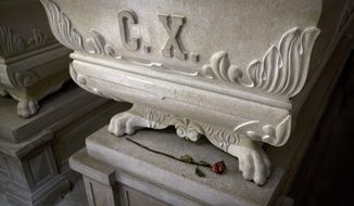 This photo from Friday, Oct. 7, 2016, shows sarcophagus of king Charles X and a rose, inside the crypt of the Kostanjevica monastery in Nova Gorica, Slovenia. The only French king buried outside France, Charles X was laid to rest in Nova Gorica nearly 200 years ago, after fleeing a French revolution. Recently, a group of historians and royalists in France have been campaigning to have the king&#x27;s remains reburied back home. (AP Photo/Darko Bandic)