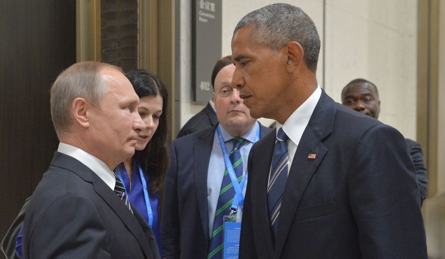 FILE - In this Sept. 5, 2016 file photo, Russian President Vladimir Putin, left, speaks with U.S. President Barack Obama in Hangzhou in eastern China&#x27;s Zhejiang province. The Russian Foreign Ministry said on Thursday, Oct. 13, 2016, that the United States is conducting a &quot;scorched earth&quot; policy in relation to Russia during the final months of Obama&#x27;s presidency. (Alexei Druzhinin/Sputnik, Kremlin Pool Photo via AP, File)