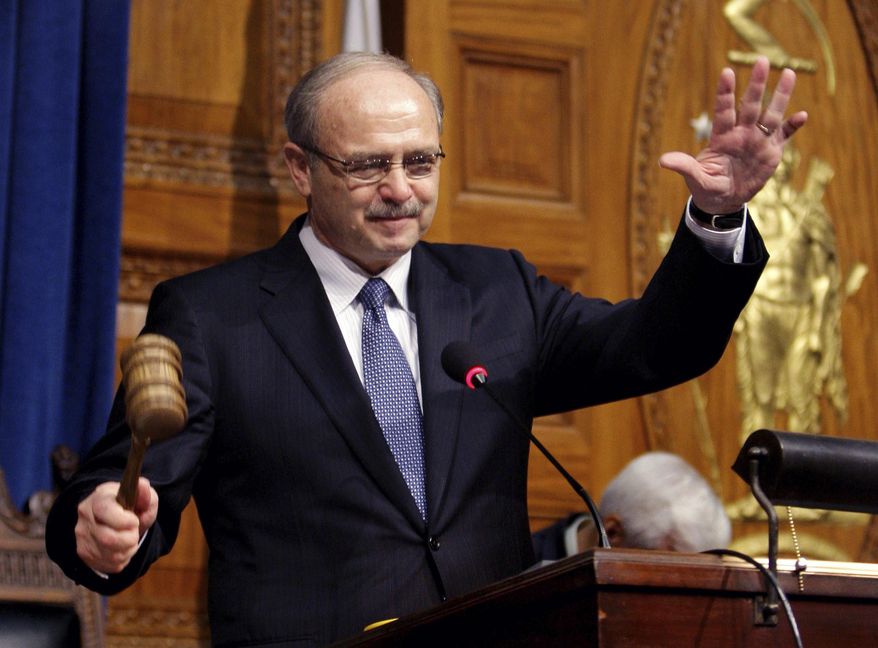 FILE-- This Jan. 7, 2009 file photograph shows Massachusetts House Speaker Salvatore DiMasi acknowledging applause from the chamber as he bangs the gavel after being re-elected at the Statehouse in Boston. Federal officials are recommending an early release from prison for DiMasi as he battles cancer. The U.S. Bureau of Prisons is filing a notice in court saying it's requesting compassionate release for the once-powerful Democrat, who has served almost five years of an eight-year term for corruption. (AP Photo/Charles Krupa)
