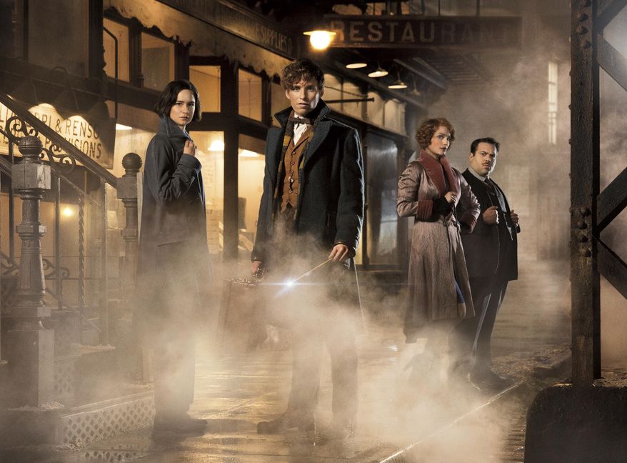 This image released by Warner Bros. Pictures shows, from left, Katherine Waterston, Eddie Redmayne, Alison Sudol and Dan Folger in a scene from "Fantastic Beasts and Where to Find Them." At a fan event for the upcoming film in London on Thursday, Oct. 13, 2016, J.K. Rowling revealed that the budding franchise will now stretch to five films. The first, starring Eddie Redmayne, opens November 18. (Jaap Buitendijk/Warner Bros. Pictures via AP)