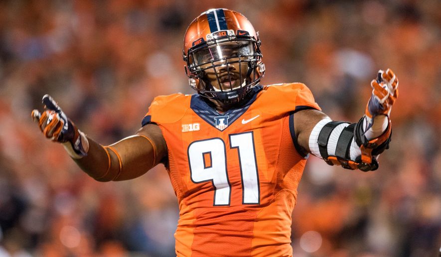 FILE - In this Sept. 10, 2016, file photo, Illinois defensive lineman Dawuane Smoot encourages the fans during an NCAA college football game against North Carolina in Champaign, Ill. Defense remains a cornerstone of Lovie Smith's plans for Illinois, particularly the defensive line that includes a couple of potential future NFL players. (AP Photo/Bradley Leeb, File)
