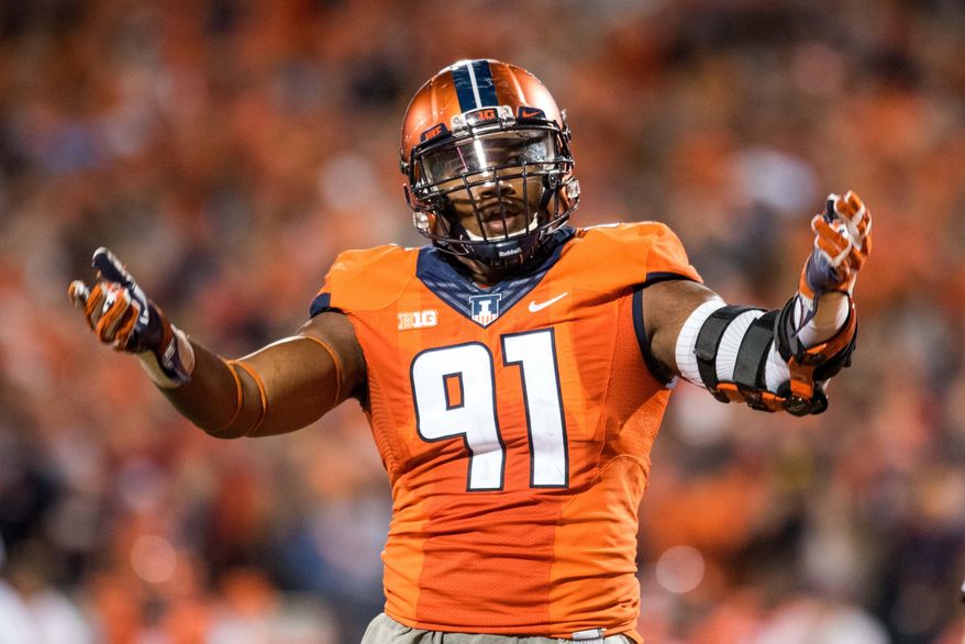 FILE - In this Sept. 10, 2016, file photo, Illinois defensive lineman Dawuane Smoot encourages the fans during an NCAA college football game against North Carolina in Champaign, Ill. Defense remains a cornerstone of Lovie Smith's plans for Illinois, particularly the defensive line that includes a couple of potential future NFL players. (AP Photo/Bradley Leeb, File)
