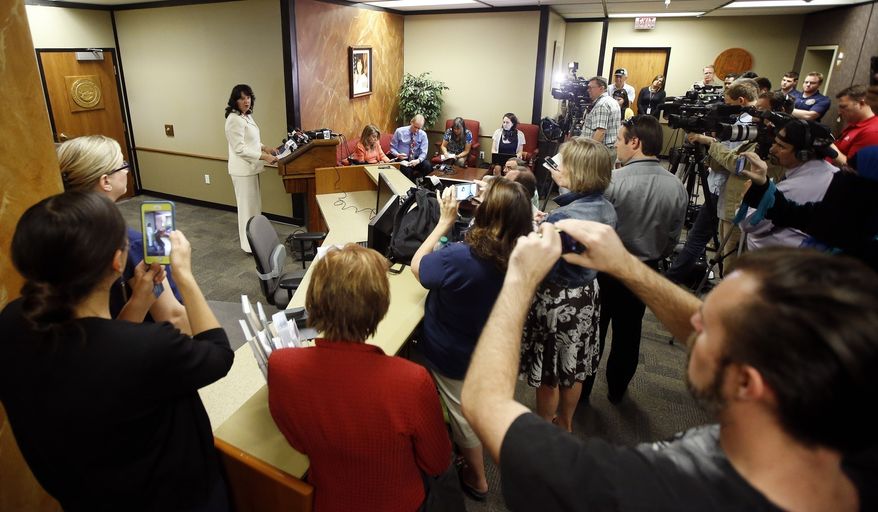 In this April 4, 2016, file photo, a large crowd of media and voting rights advocates listen as Arizona Secretary of State Michele Reagan speaks during a news conference after she certified the official canvass of the Arizona presidential primary election in Phoenix. New ID requirements. Unfamiliar or distant polling places. Names missing from the voter rolls. Those are just some of the challenges that could disrupt voting across the country through Election Day. While most elections have their share of glitches, experts worry conditions are ripe this year for trouble at the nations polling places. (AP Photo/Ross D. Franklin, File)