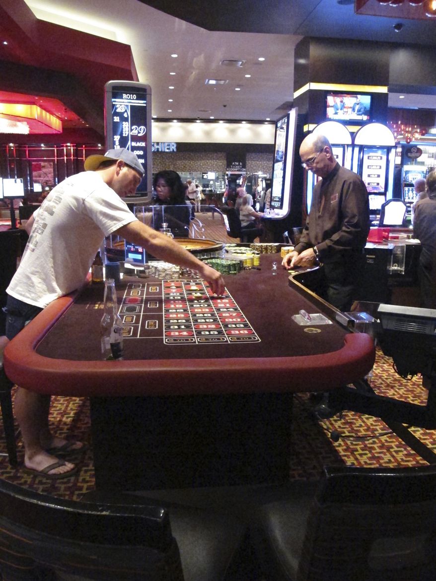 In a June 24, 2016 photo, a game of roulette is underway at the Golden Nugget casino in Atlantic City N.J. Figures released by New Jersey gambling regulators on Thursday Oct. 13, 2016 show the Golden Nugget's September casino revenue increased by 9.5 percent to $21.5 million compared with a year ago. (AP Photo/Wayne Parry)
