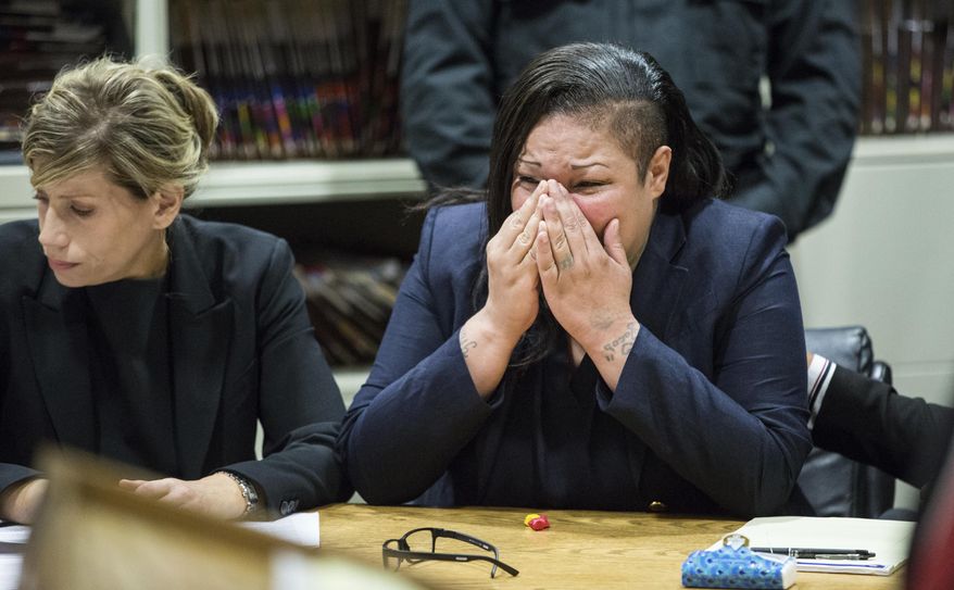 Jacqueline Montanez reacts to a testimony by the brother of one of the victims, during her sentencing hearing at Leighton Criminal Court Building in Chicago on Friday, Oct. 14, 2016. Montanez, who was a juvenile when she was sentenced to life in prison for killing two gang rivals in 1992, was resentenced to 63 years in prison, clearing the way for her release in as soon as 7 1/2 years. Her case was one of dozens in Illinois sent back for resentencing after the U.S. Supreme Court in 2012 found mandatory natural life sentences for juveniles unconstitutional. (Zbigniew Bzdak/Chicago Tribune via AP, Pool)