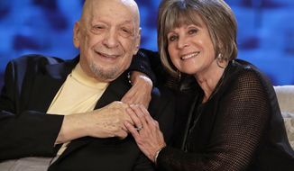 In this Sept. 22, 2016 photo, songwriter Fred Foster poses with Barbara “Bobbie&amp;quot; Eden, right, at the Country Music Hall of Fame and Museum in Nashville, Tenn. Eden&#39;s last name was McKee when she worked as a secretary in the same office building with Foster when he and Kris Kristofferson wrote “Me and Bobby McGee.” Her name was the inspiration for the song. (AP Photo/Mark Humphrey)