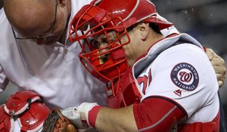 FILE - In this Sept. 26, 2016, file photo, Washington Nationals catcher Wilson Ramos goes down with a knee injury during the sixth inning of a baseball game against the Arizona Diamondbacks in Washington. Ramos had surgery Friday, Oct. 14, 2016, on his right knee and his rehabilitation is expected to take six-to-eight months. (AP Photo/Andrew Harnik, File)