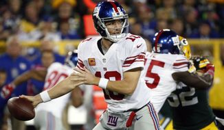 FILE - In this Oct. 9, 2016, file photo, New York Giants&#x27; Eli Manning throws during the first half of an NFL football game against the Green Bay Packers in Green Bay, Wis. Manning has not been sharp and the offensive line has been inconsistent. (AP Photo/Mike Roemer, File)