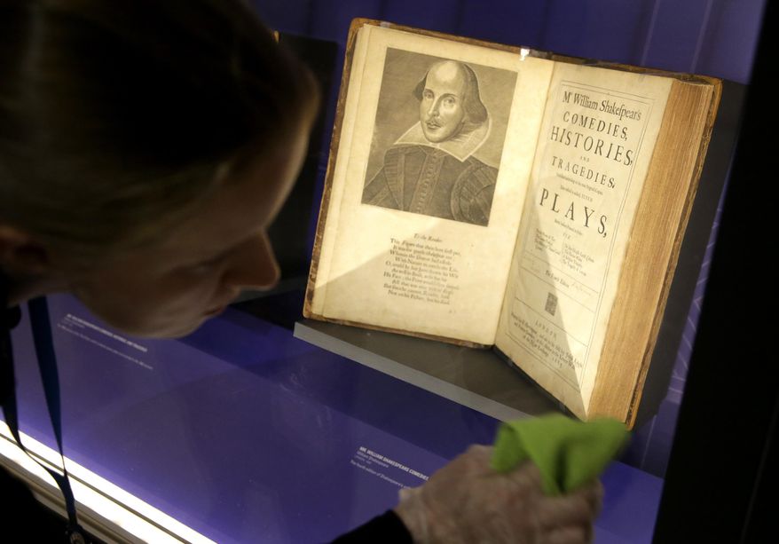 In this Tuesday, Oct. 11, 2016 photo book conservator Lauren Schott polishes a case containing 17th century editions of plays attributed to William Shakespeare in an exhibit called &amp;quot;Shakespeare Unauthorized&amp;quot; at the Boston Public Library, in Boston. The public is to get a rare glimpse of first and early editions of some of Shakespeare&#39;s most beloved plays, including &amp;quot;A Midsummer Night&#39;s Dream,&amp;quot; Hamlet&amp;quot; and &amp;quot;The Merchant of Venice&amp;quot; in the exhibit which opens Friday, Oct. 14 and is to run through March 31 at the library. (AP Photo/Steven Senne)