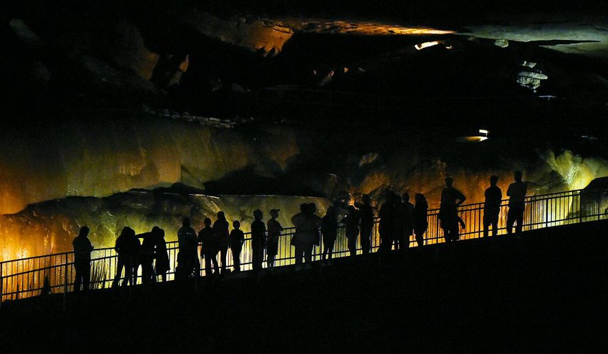 FILE - In this Sept. 9, 2016 file photo, tourist look over Cathedral Caverns State Park in Woodville, Ala. Alabama voters on Election Day will have their say on 14 proposed statewide amendments. One of those is aimed at protecting money for Alabama’s 21 state parks. Amendment 2 would prohibit money generated at state parks_ as well as tax dollars earmarked for park maintenance _ from being transferred to other government functions. It would also allow more private entities to run hotels, golf courses and restaurants at the parks. (Joe Songer /AL.com via AP)
