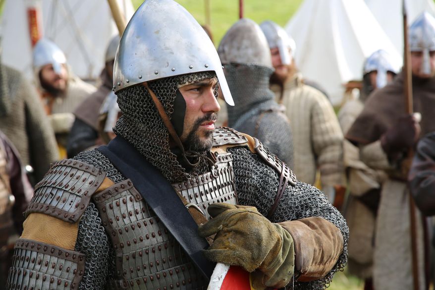 Re-enactors gather in Battle, near Hastings to re-enact the ancient clash between King Harold and William the Conqueror on the 950th anniversary of the fabled Battle of Hastings, Saturday Oct. 15, 2016. Some thousands of history buffs including many in full costume marked the 1066 Battle of Hastings with a dramatic reenactment that commemorates one of the most important events in British history. (Angus Dunsire / PA via AP)