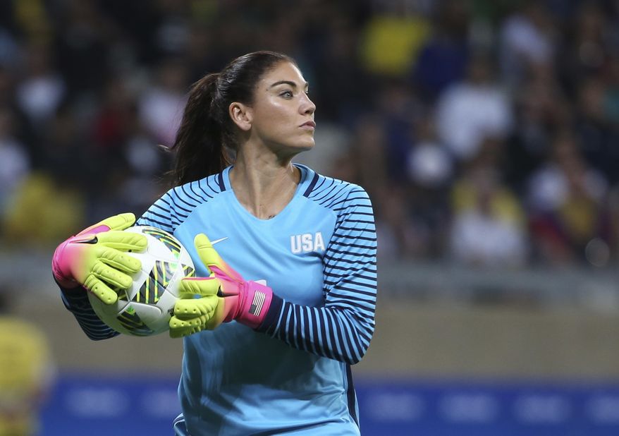 FILE - In this Aug. 3, 2016, file photo, United States&#x27; goalkeeper Hope Solo takes the ball during a women&#x27;s soccer game at the Rio Olympics against New Zealand in Belo Horizonte, Brazil. Hope Solo says she&#x27;s received several offers to play overseas and could even continue her career in Sweden, whose fans she enraged by describing their national team as &amp;quot;cowards&amp;quot; at the Rio Olympics. (AP Photo/Eugenio Savio, File)