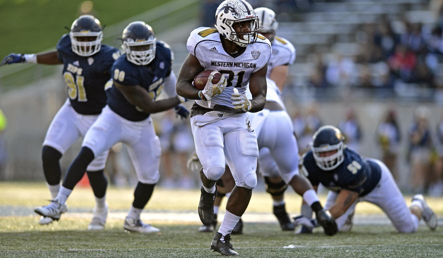 Western Michigan running back Jarvion Franklin carries the ball in the second quarter of an NCAA college football game against Akron, Saturday, Oct. 15, 2016, in Akron, Ohio. (AP Photo/David Dermer)