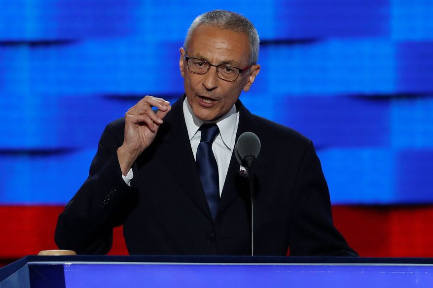 not alone: John Podesta received an email from Apollo 14 astronaut Edgar D. Mitchell urging them to meet to discuss extraterrestrial intelligence. (Associated Press)