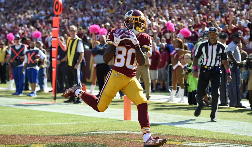 Washington Redskins wide receiver Jamison Crowder scores a touchdown in the first half of an NFL football game against the Philadelphia Eagles, Sunday, Oct. 16, 2016, in Landover, Md. (AP Photo/Nick Wass)