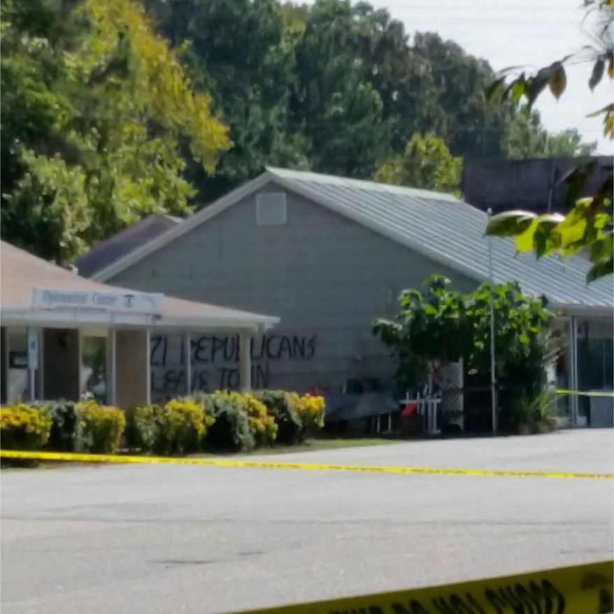 A swastika and the message, "Nazi Republicans, leave town or else" were painted in black on the side of a building near the firebombed headquarters of the Orange County Republican Party. (North Carolina Republican Party Facebook page)