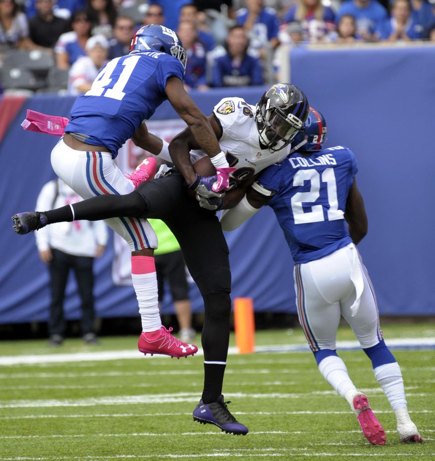 Baltimore Ravens wide receiver Breshad Perriman (18) catches a pass between New York Giants&#x27; Dominique Rodgers-Cromartie (41) and Landon Collins (21) during the first half of an NFL football game Sunday, Oct. 16, 2016, in East Rutherford, N.J. (AP Photo/Bill Kostroun)