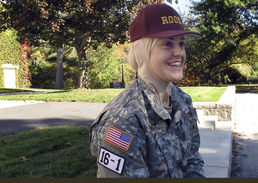 In this Oct. 12, 2016 photo, freshman student Sana Hamze speaks in Northfield, Vt., about her time as a "rook," or first year student in the military college's Corps of Cadets. Norwich University has allowed Hamze to wear her Muslim headscarf as part of her Norwich uniform. Hamze chose Norwich after another military school refused to change its uniform code to accommodate her request. (AP Photo/Wilson Ring)