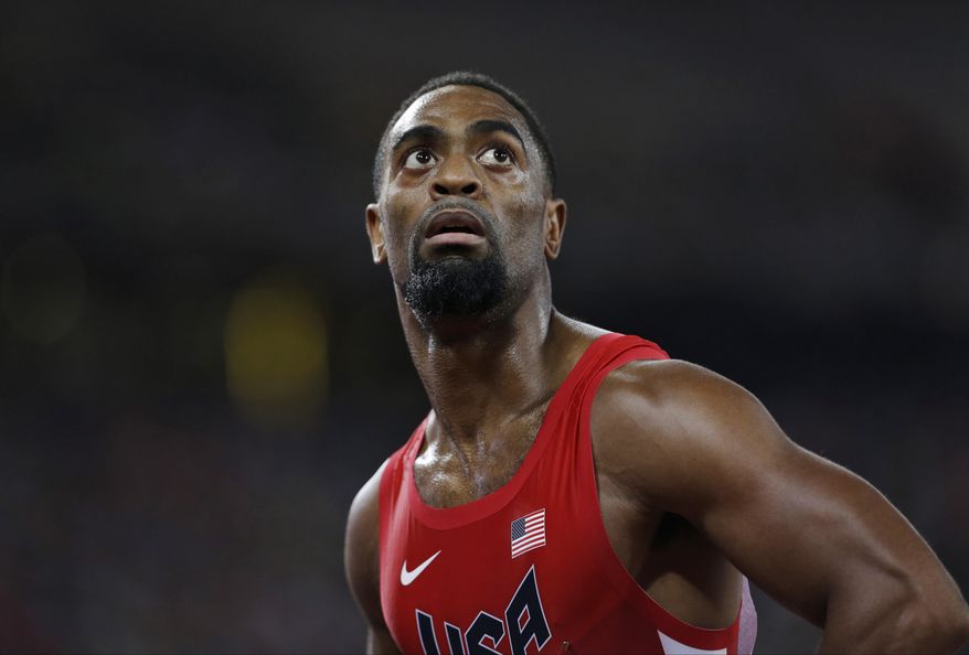 FILE - In this Aug. 23, 2015, file photo, United States' Tyson Gay looks at his time from a men's 100-meter semifinal at the World Athletics Championships at the Bird's Nest stadium in Beijing. The 15-year-old daughter of Olympic sprinter Tyson Gay has been fatally shot in Kentucky, the athlete's agent and authorities said Sunday, Oct. 16, 2016. Trinity Gay died at the University of Kentucky Medical Center, the coroner's office for Fayette County said in a statement. (AP Photo/David J. Phillip, File)