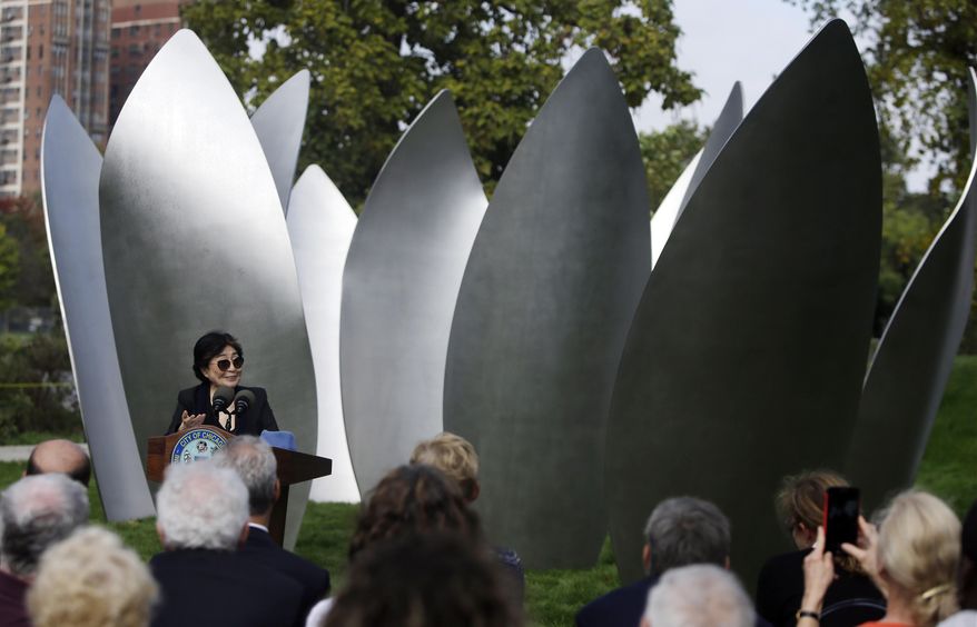 Yoko Ono speaks during the dedication ceremony for her permanent art installation, a sculpture called SKYLANDING, Monday, Oct. 17, 2016, in Chicago. SKYLANDING is Ono's first permanent public art installation in the United States. (AP Photo/Kiichiro Sato)