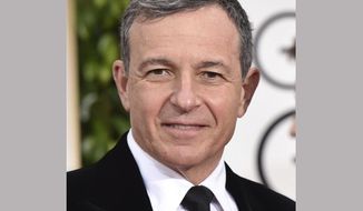 FILE - In this Jan. 11, 2015 file photo, chairman and CEO of the Walt Disney Company, Robert A. Iger, arrives at the 72nd annual Golden Globe Awards in Beverly Hills, Calif. Iger, is working on a book about “leadership and management.” Random House announced Monday that Iger would reflect on the “ideas, values and growth strategies” that have underlined his 11 years running the entertainment giant. The book, which will include his thoughts on such key decisions as the acquisition of Pixar, is currently untitled and does not yet have a release date. (Photo by John Shearer/Invision/AP, FIle)