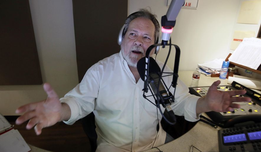 ADVANCE FOR USE THURSDAY, OCT. 20, 2016 AND THEREAFTER-Radio talk show host Rick Roberts speaks will a caller during his program in Dallas on Tuesday, Sept. 6, 2016. "I want America to be America," he says. "I want some semblance of what this country used to be. It's worth protecting. It's worth defending. I don't recognize this country anymore." (AP Photo/LM Otero)