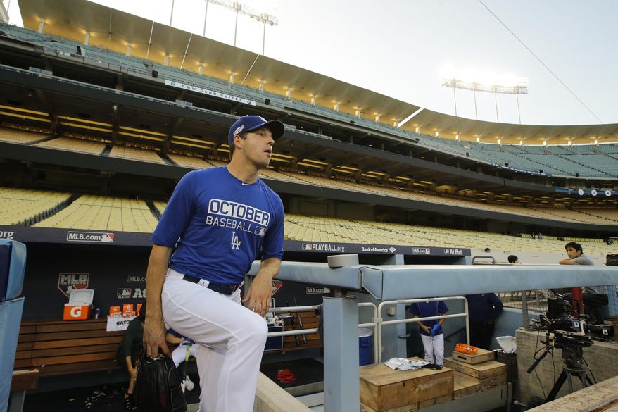 Los Angeles Dodgers starting pitcher Rich Hill walks out of the dugout to practice ahead of Tuesday's Game 3 of the National League baseball championship series against the Chicago Cubs, Monday, Oct. 17, 2016, in Los Angeles. (AP Photo/Jae C. Hong)
