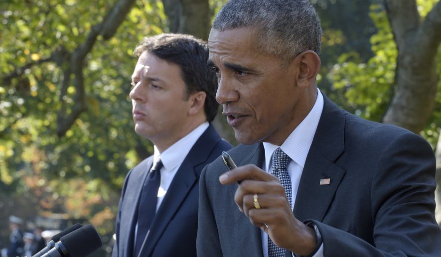 President Barack Obama, accompanied by Italian Prime Minister Matteo Renzi, speaks during their joint news conference in the Rose Garden of the White House in Washington, Tuesday, Oct. 18, 2016. (AP Photo/Susan Walsh)