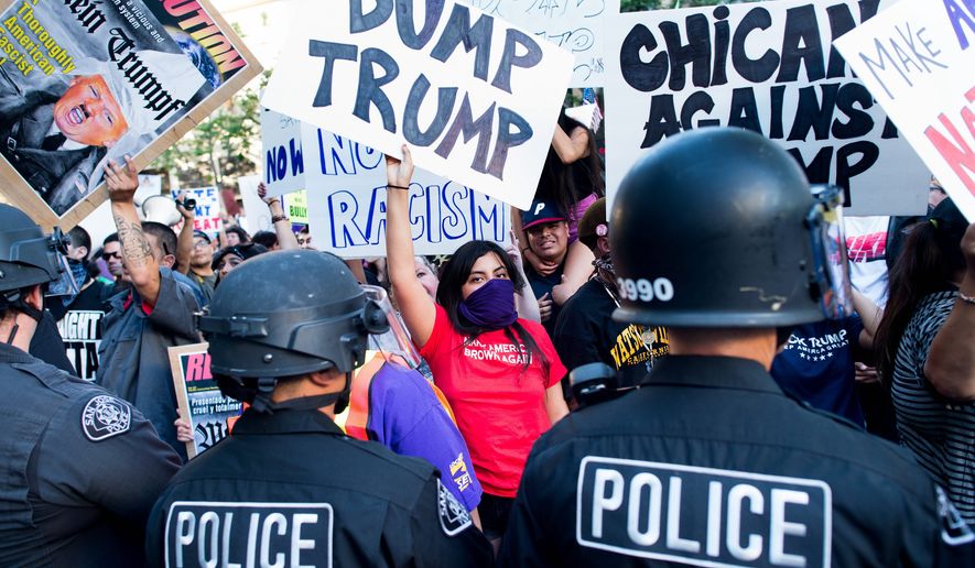 People were hired by Democratic strategists to stir up trouble at rallies for Republican presidential candidate Donald Trump. Officials with Democracy Advocates and Americans United for Change stepped down after a video by Project Veritas Action confirmed their political chicanery. (Associated Press)