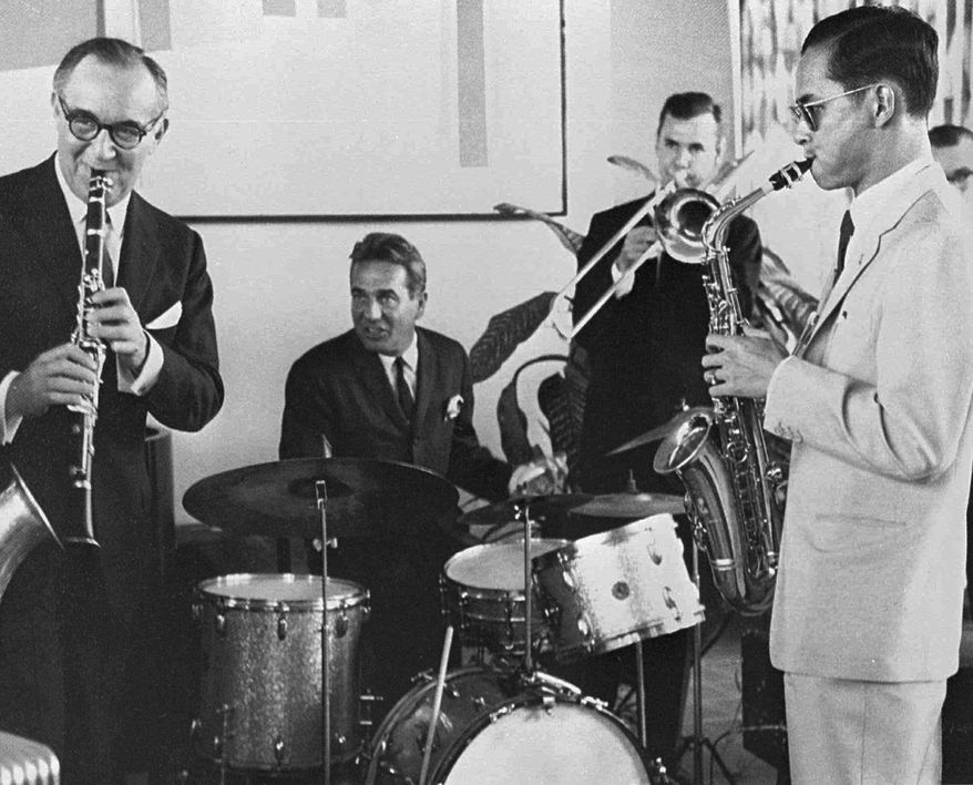 FILE - In this July 5, 1960, file photo, Thailand's King Bhumibol Adulyadej, right, plays the saxophone during a jam session with legendary jazz clarinetist Benny Goodman, left, drummer Gene Krupa, second left, and trombonist Urbie Green in New York. Aside from his kingly duties _ and they were immense _ Thailand's late King Bhumibol Adulyadej took time out during his 70-year reign to compose music (and jam with some of the world's jazz legends), build sailing craft (and win an international yachting race), paint surrealistic oils and have some 20 patents registered for an assortment of inventions. (Bureau of the Royal Household via AP, File)