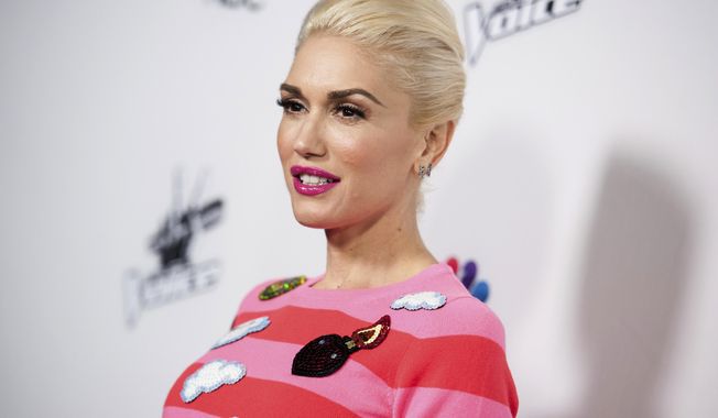 FILE - In this Monday, Dec. 8, 2014, file photo, Gwen Stefani arrives at &amp;quot;The Voice&amp;quot; Red Carpet Event in Los Angeles. Stefani will be back on “The Voice” and joining current coaches Alicia Keys, Adam Levine and Blake Shelton for Season 12 of NBC’s musical competition series. It will begin in February 2017. (Photo by Richard Shotwell/Invision/AP, File)