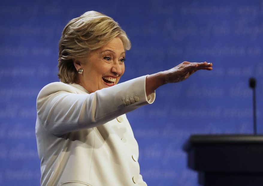 Democratic presidential nominee Hillary Clinton waves to guests following the third presidential debate with Republican presidential nominee Donald Trump at UNLV in Las Vegas, Wednesday, Oct. 19, 2016. (AP Photo/Patrick Semansky)