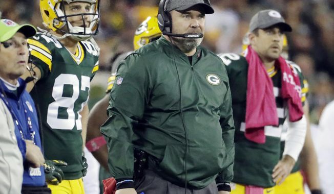 FILE - In this Oct. 9, 2016 file photo, Green Bay Packers head coach Mike McCarthy watches an NFL football game against the New York Giants in Green Bay, Wis. The NFL&#x27;s oldest rivalry will be renewed on Thursday, Oct. 20, 2016, when the Chicago Bears visit the Packers. It&#x27;s the 193rd meeting between the NFC North rivals. (AP Photo/Morry Gash, File)