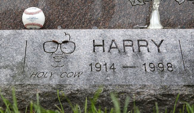 A baseball sits on the grave stone of famed Chicago Cubs broadcaster Harry Carey at All Saints Cemetery Wednesday, Oct. 19, 2016, in Des Plaines, Ill. In a city where fans have been known to scatter ashes of the dearly departed at Wrigley Field, families of those who could no longer wait &#x27;till next season are planting Cubs pennants and flags at the graves of loved ones or sending them off to the great beyond with Cubs hats and jerseys in their caskets. (AP Photo/Charles Rex Arbogast)