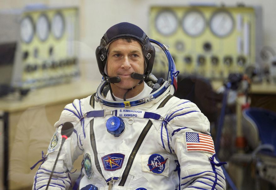 U.S. astronaut Shane Kimbrough, a member of the main crew to the International Space Station (ISS), talks to his relatives prior to the launch of the Soyuz MS-02 space ship, in Russian leased Baikonur cosmodrome, Kazakhstan, on Wednesday, Oct. 19, 2016. (AP Photo/Ivan Sekretarev, Pool)