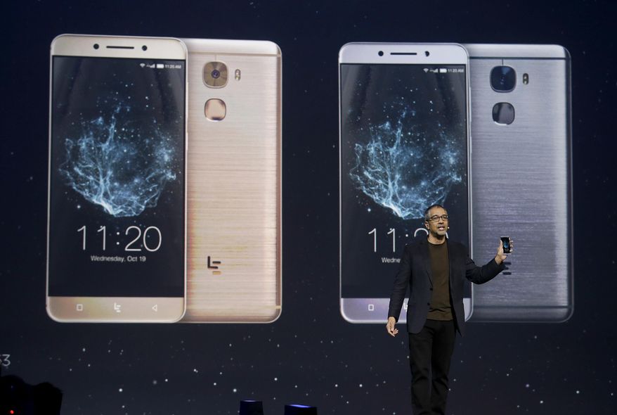 Rob Chandhok, LeEco North America chief research and development officer, holds a LePro 3 phone while speaking at an event in San Francisco, Wednesday, Oct. 19, 2016. (AP Photo/Jeff Chiu)