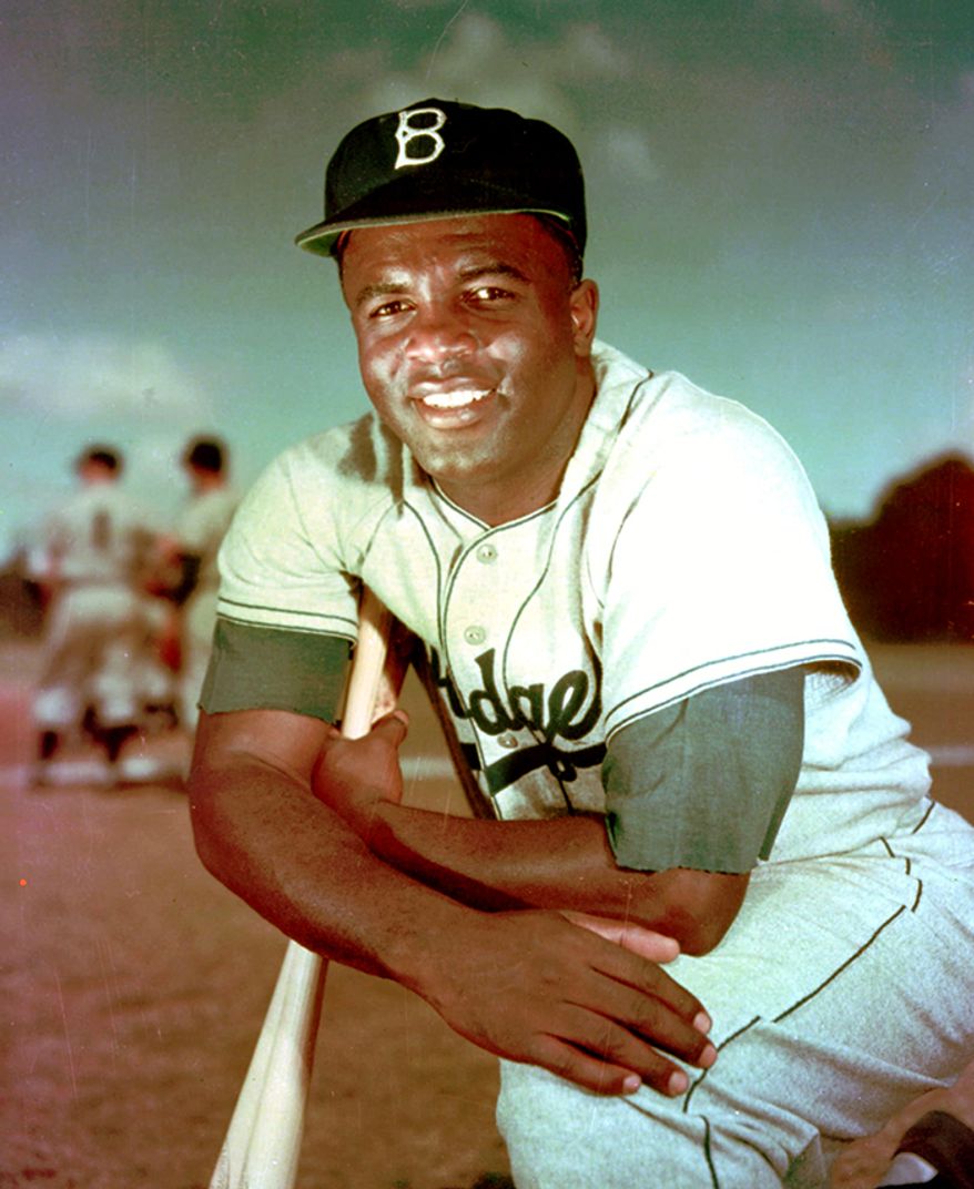 Jackie Robinson became the first African American to play in Major League Baseball (MLB) in the modern era. Robinson broke the baseball color line when the Brooklyn Dodgers started him at first base on April 15, 1947. The Dodgers, by signing Robinson, heralded the end of racial segregation in professional baseball that had relegated black players to the Negro leagues since the 1880s. Robinson was inducted into the Baseball Hall of Fame in 1962. Robinson had an exceptional 10-year baseball career. He was the recipient of the inaugural MLB Rookie of the Year Award in 1947, was an All-Star for six consecutive seasons from 1949 through 1954, and won the National League Most Valuable Player Award in 1949the first black player so honored. Robinson played in six World Series and contributed to the Dodgers&#39; 1955 World Series championship. In 1997, MLB &quot;universally&quot; retired his uniform number, 42, across all major league teams; he was the first pro athlete in any sport to be so honored. MLB also adopted a new annual tradition, &quot;Jackie Robinson Day&quot;, for the first time on April 15, 2004, on which every player on every team wears No.&amp;#160;42. (AP Photo/File)