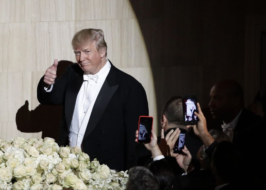 Republican presidential nominee Donald Trump, gestures as he walks to the Dais at the 71st Annual Alfred E. Smith Memorial Foundation Dinner Thursday, Oct. 20, 2016, in New York. (AP Photo/Frank Franklin II)