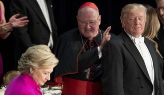 Democratic presidential candidate Hillary Clinton and Republican nominee Donald Trump joined Cardinal Timothy Dolan, Archbishop of New York, at the 71st annual Alfred E. Smith Memorial Foundation Dinner last month in New York. (Associated Press)