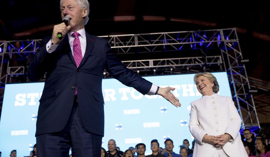 Former President Bill Clinton, left, accompanied by Democratic presidential candidate Hillary Clinton speaks at debate watch party at the Craig Ranch Regional Amphitheater in North Las Vegas, Wednesday, Oct. 19, 2016, following the third presidential debate. (AP Photo/Andrew Harnik)