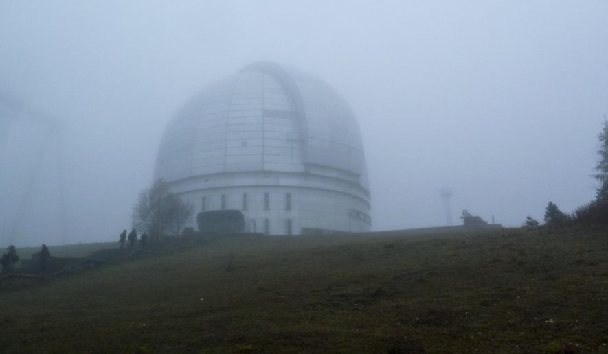 In this photo taken Saturday, Oct. 15, 2016 the Astrophysical Observatory at Nizhny Arkhyz, in Karachay-Cherkessia, southern Russia. Set high in the mountains of the North Caucasus, the Special Astrophysical Observatory of the Russian Academy of Sciences once housed the world's largest space telescope when it was opened in the 1970s. The Observatory is the setting for an art installation that explores the near-infinite reaches of both outer space and the human imagination. (AP Photo/Kate de Pury)