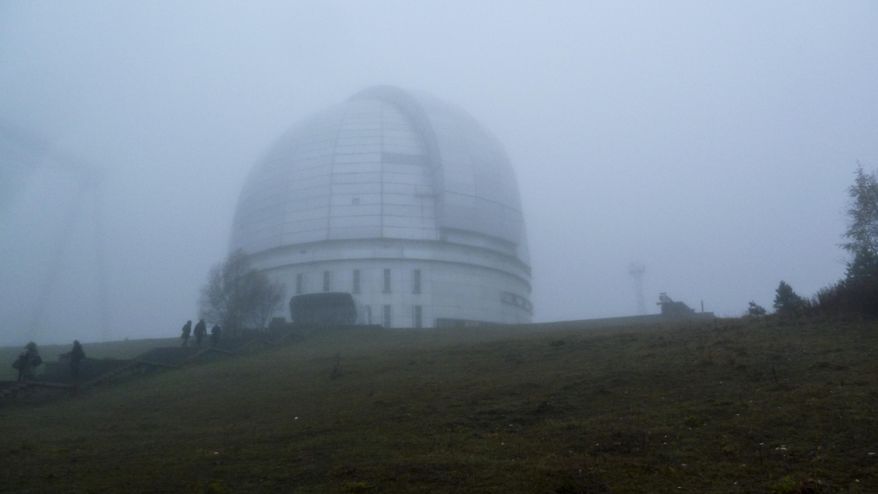In this photo taken Saturday, Oct. 15, 2016 the Astrophysical Observatory at Nizhny Arkhyz, in Karachay-Cherkessia, southern Russia. Set high in the mountains of the North Caucasus, the Special Astrophysical Observatory of the Russian Academy of Sciences once housed the world's largest space telescope when it was opened in the 1970s. The Observatory is the setting for an art installation that explores the near-infinite reaches of both outer space and the human imagination. (AP Photo/Kate de Pury)