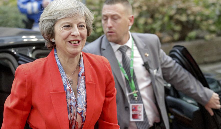 British Prime Minister Theresa May arrives on the second day of the EU summit in Brussels, Friday, Oct. 21, 2016. May briefed her European counterparts on the exit road for Britain and left leaders with many uncertainties about the divorce because Britain has yet to trigger the two-year negotiations for &quot;Brexit&quot;  and confirmed she is unlikely to do so until the end of March. (AP Photo/Olivier Matthys)