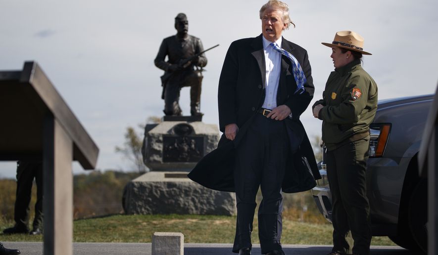 Interpretive park ranger Caitlin Kostic, right, gives a tour near the high-water mark of the Confederacy at Gettysburg National Military Park to Republican presidential candidate Donald Trump, Saturday, Oct. 22, 2016, in Gettysburg, Pa. (AP Photo/ Evan Vucci)