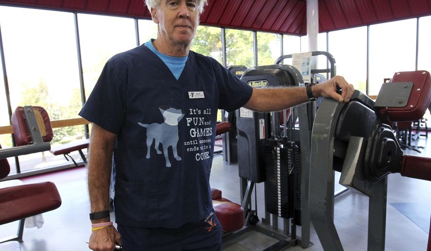 ADVANCE FOR MONDAY OCT. 24 AND THEREAFTER - In this Wednesday Oct. 5, 2016 photo, Rick Millen, a veterinarian and also a personal trainer poses at the YMCA in Huntington, W.Va. (Lori Wolfe/The Herald-Dispatch via AP)