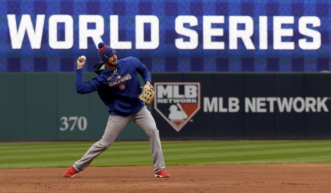 Chicago Cubs third baseman Kris Bryant warms up during a team practice for baseball&#x27;s upcoming World Series against the Cleveland Indians on Monday, Oct. 24, 2016 in Cleveland. (AP Photo/David J. Phillip)
