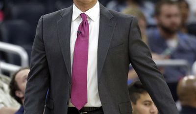 In this Thursday, Oct. 20, 2016, photo, Orlando Magic head coach Frank Vogel directs his team against the New Orleans Pelicans during the second half of an NBA preseason basketball game in Orlando, Fla. Tipping off an NBA season isn&#39;t new to Vogel, yet this year is a different for the veteran coach. The always optimistic Vogel is preparing to begin a new era with the Magic after being unceremoniously dismissed by the Indiana Pacers. (AP Photo/John Raoux)