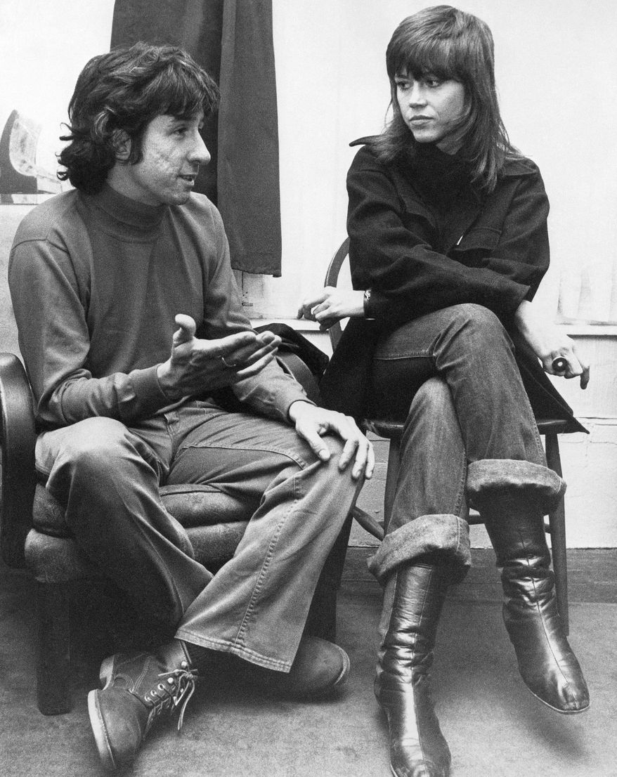In this Dec. 26, 1972, file photo, actress Jane Fonda, right, and Tom Hayden, one of the founders of SDS, talk at the home of a friend in London, after their arrival from Paris. Hayden, the famed 1960s anti-war activist who moved beyond his notoriety as a Chicago 8 defendant to become a California legislator, author and lecturer, has died at age 76. His wife, Barbara Williams, says Hayden died on Sunday, Oct. 23, 2016, in Santa Monica of a long illness. (AP Photo, File)