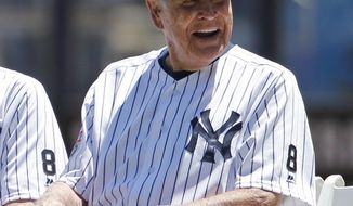 FILE - In this June 12, 2016, file photo, former New York Yankees player Eddie Robinson smiles before the Yankees annual Old Timers Day baseball game, in New York. The Cleveland Indians and the Chicago Cubs start the World Series with Game 1 in Cleveland on Tuesday, Oct. 25. Eddie Robinson is the last living member of the Cleveland Indians 1948 World Series team. (AP Photo/Kathy Willens, File)